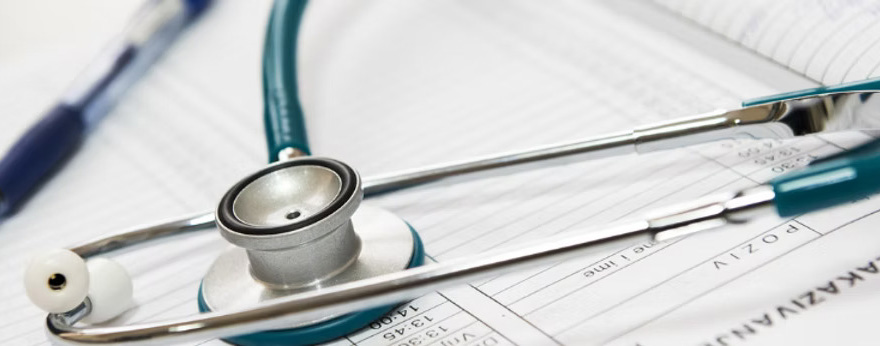 Stethoscope on top of documents